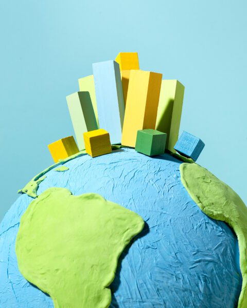 Buildings on top of the globe graphic
