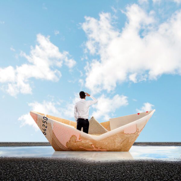 Man in paper boat graphic