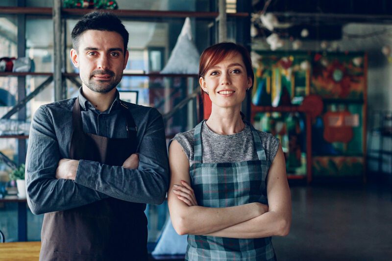 Man and woman each with arms folded