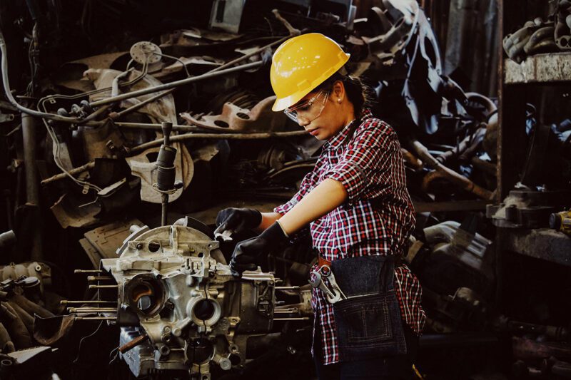 Woman worker in yellow hard hat