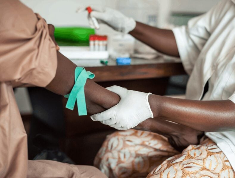 African healthcare worker giving injection