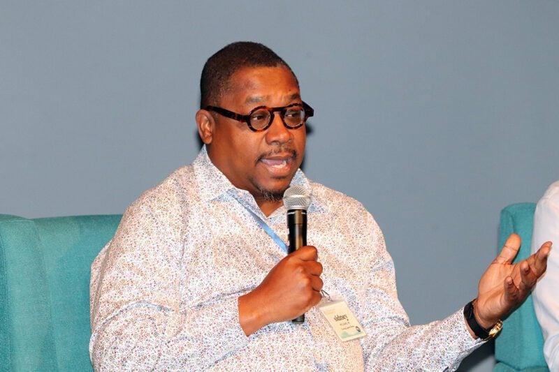 Rev. Dr Sidney Williams speaking with microphone