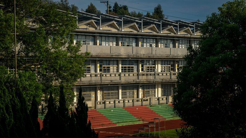 School building with stands and track