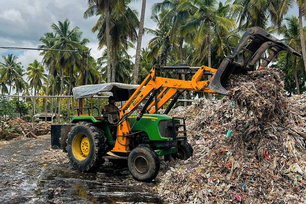 Tractor moving waste
