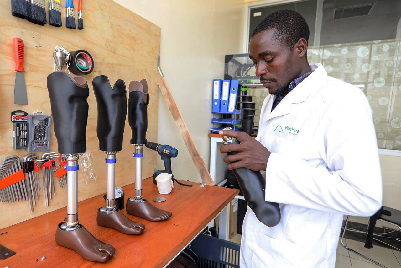 African worker with leg prosthetics
