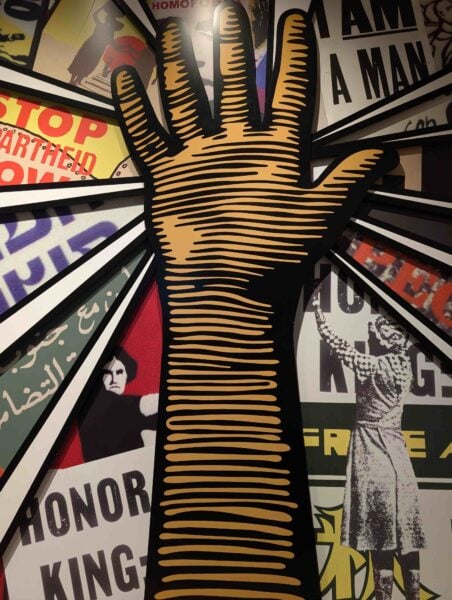 Mural of hand raised in protest 