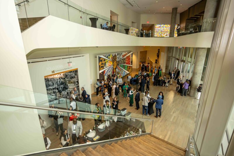 Conference attendees in lobby of Center