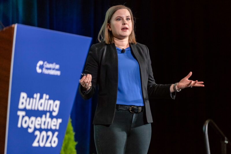 Woman speaking on conference stage