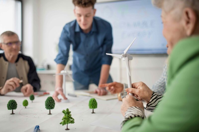 People designing city at conference table