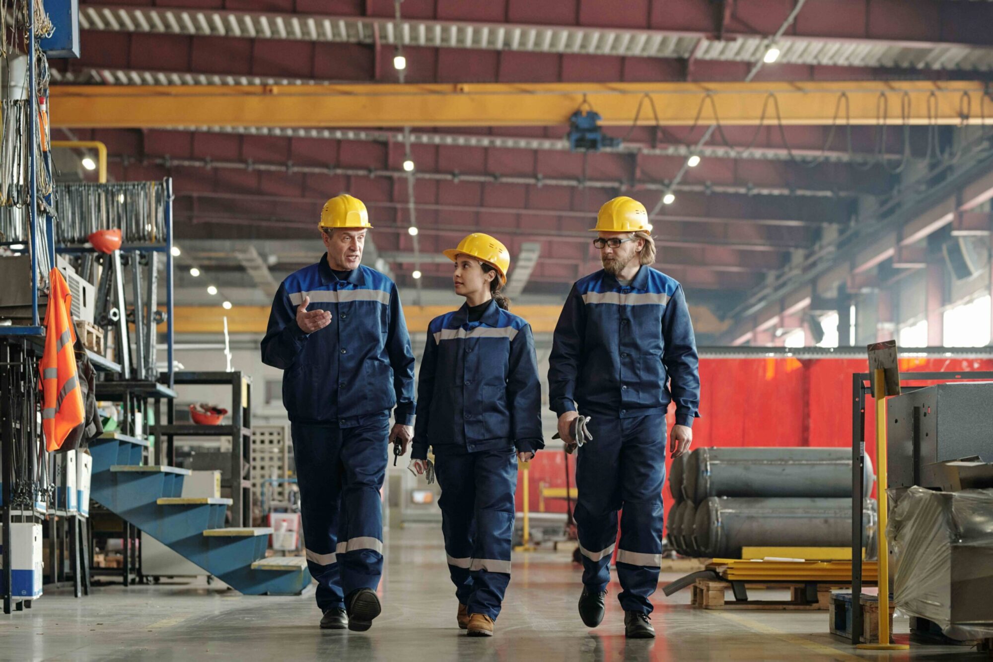workers walking through industrial workspace