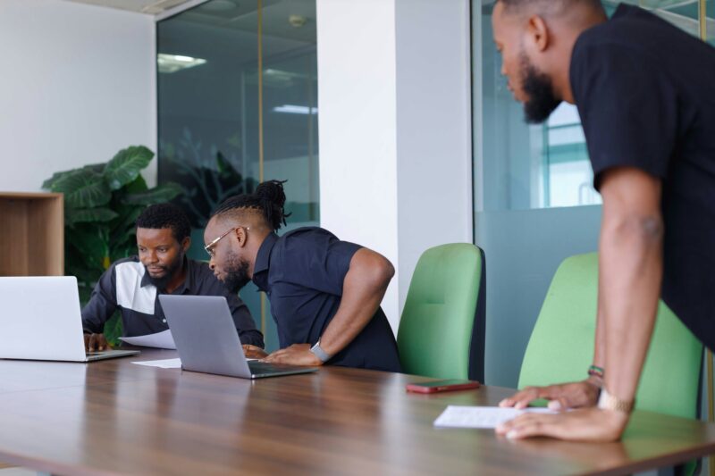 Three African entrepreneurs working on laptops
