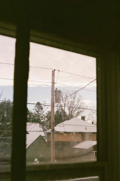 Electrical pole seen through window